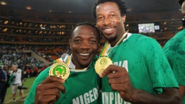Nigeria’s forward Ahmed Musa (L) and Nigeria's defender Efe Ambrose pose with their medals after winning the 2013 African Cup of Nations final over Burkina Faso on February 10, 2013 at Soccer City stadium in Johannesburg. (AFP)