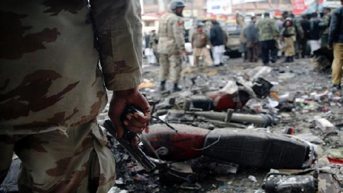 A paramilitary soldier stands guard at the scene of a bomb explosion in Quetta January 10, 2013. (Reuters)