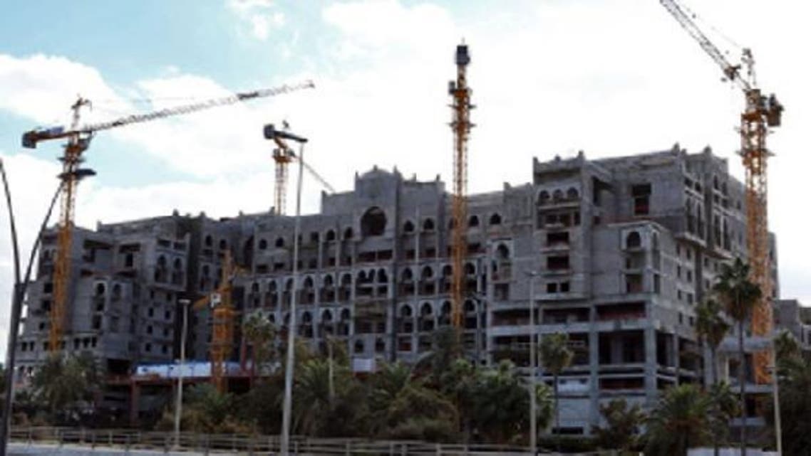 A picture shows cranes surrounding a construction site which started during the regime of ousted dictator Muammar Qaddafi and has since been put on hold, on January 23, 2013 in Tripoli. (AFP)