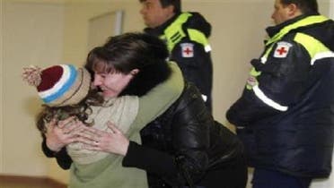 A woman hugs her daughter, who was a passenger on a Russian Emergencies Ministry flight from Beirut, after her arrival at Moscow\'s Domodedovo airport. (Reuters)