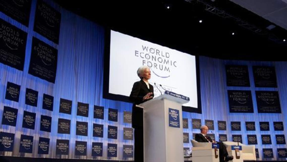 International Monetary Fund (IMF) chief Christine Lagarde addresses the annual meeting of the World Economic Forum (WEF), next to WEF founder Klaus Schwab (R), in Davos Jan. 23, 2013. (Reuters)