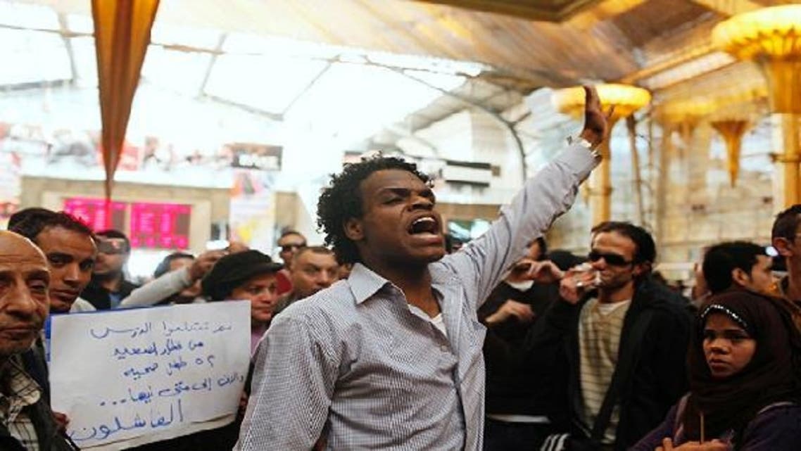 Protesters chant anti-Muslim brotherhood slogans blaming them for the train crash of Badrashin, at the main rail ways station in Cairo, January 15, 2013. A military train carrying young recruits to an army camp derailed in a Cairo suburb on Tuesday, killing 19 people and injuring 107. (Reuters)