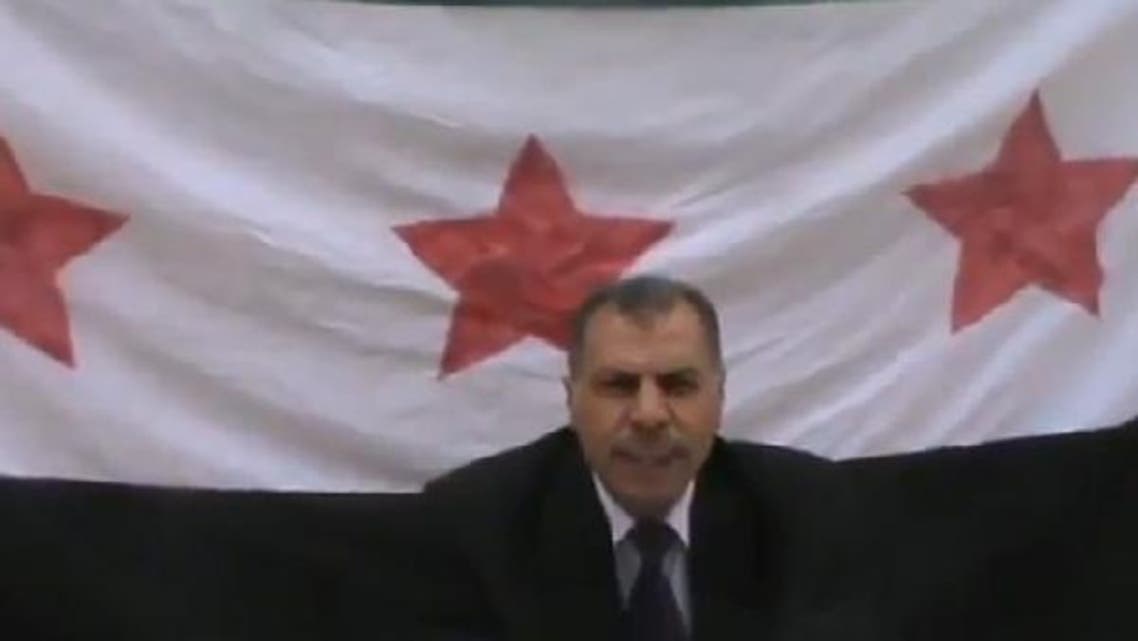 An image grab of a YouTube video showing a senior foreign intelligence official announcing his defection. (Courtesy of Free SyrRev)