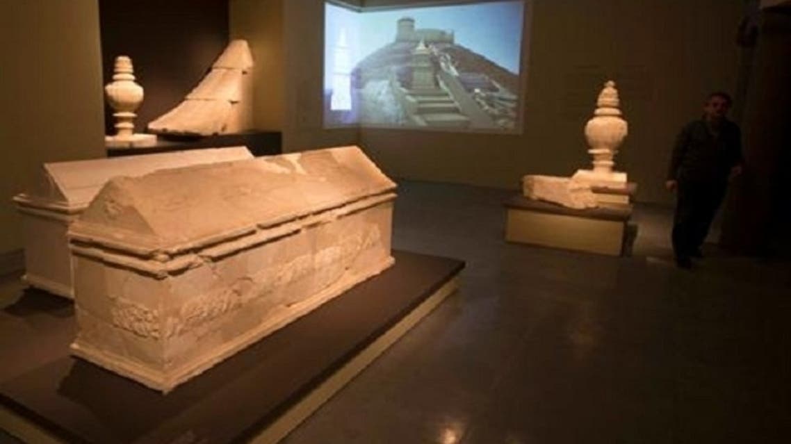 A man walks near sarcophagi during a media preview of an exhibition titled “Herod the Great: The King's Final Journey” at the Israel Museum in Jerusalem Feb. 12, 2013. (Reuters)