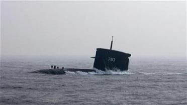 A U.S. submarine\'s periscope strikes a vessel in the Gulf on Thursday. (Reuters)