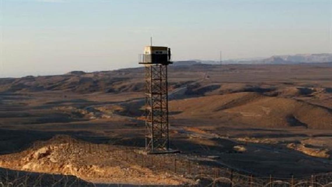 An Egyptian soldier stands guard on a watchtower on the border between Israel and Egypt, some 30 km north of Eilat. (Reuters)