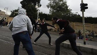 Masked attackers fire petrol bombs at Egypts presidential palace protesters