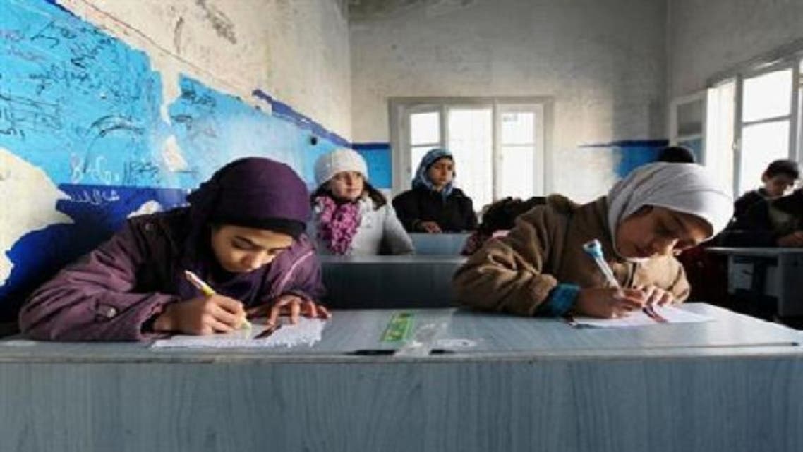 Children attend a class at Al-Tawheed school in Aleppo January 1, 2013. (Reuters)