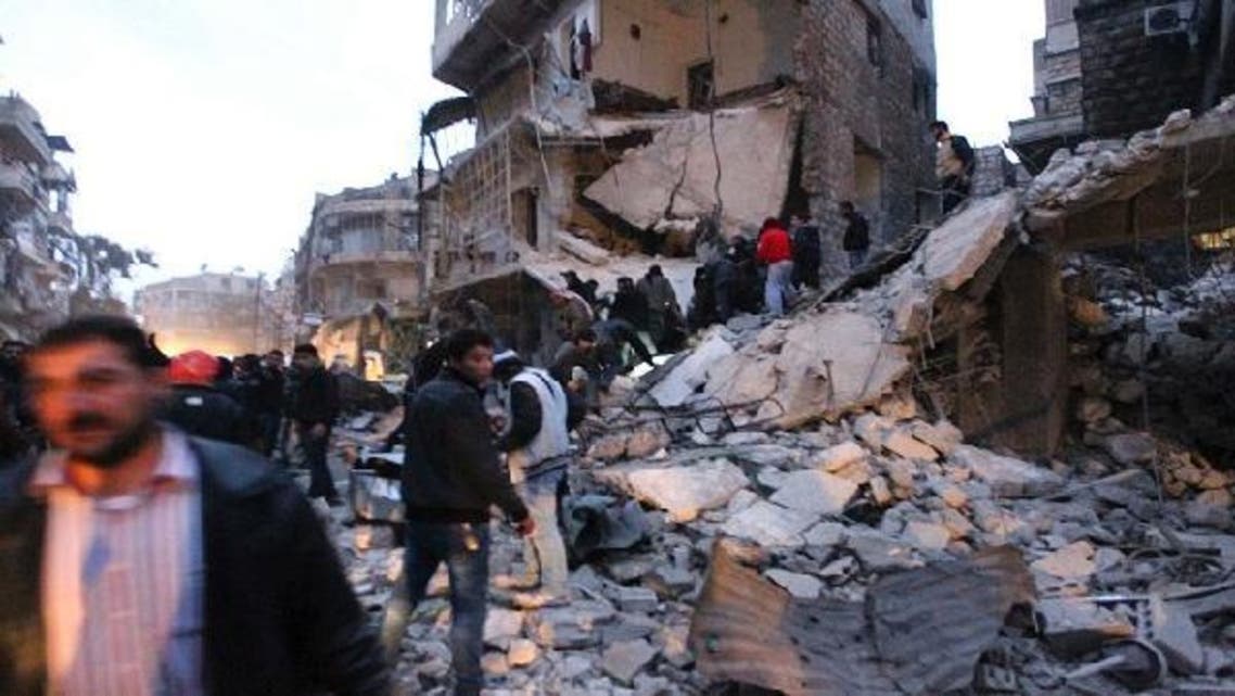 Men search for survivors under rubble after a missile hit Aleppo\'s al-Mashhad district January 7, 2013. (Reuters)