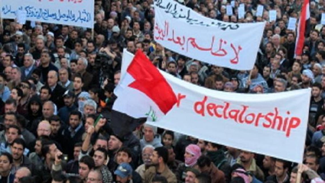 Thousands of Sunni Muslim protestors hold banners and shout slogans during a demonstration on January 4, 2013 criticising Iraq’s premier and demanding the release of prisoners they say are wrongfully held, near Abu Hanifa mosque, in the mostly Sunni Muslim neighbourhood of Aldhamiya in Baghdad. (Reuters)