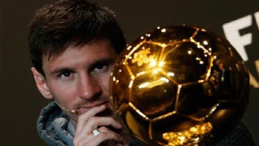 FIFA Men\'s Ballon d\'Or of the Year 2012 winner Lionel Messi of Argentina watches the trophy during a news conference before the FIFA Ballon d\'Or 2012 soccer awards ceremony at the Kongresshaus in Zurich. (Reuters)
