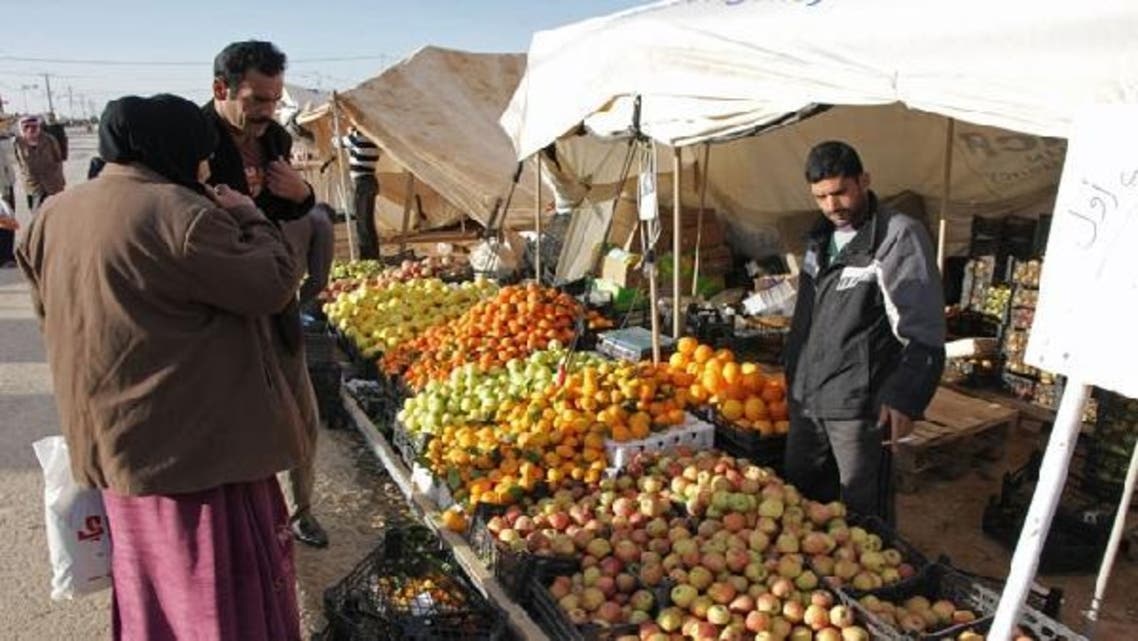 A Syrian refugee man selling beans at the Zaatari refugee camp home to more than 55,000 Syrians, located close to the Jordanian city of Mafraq, near the border with Syria. (AFP)