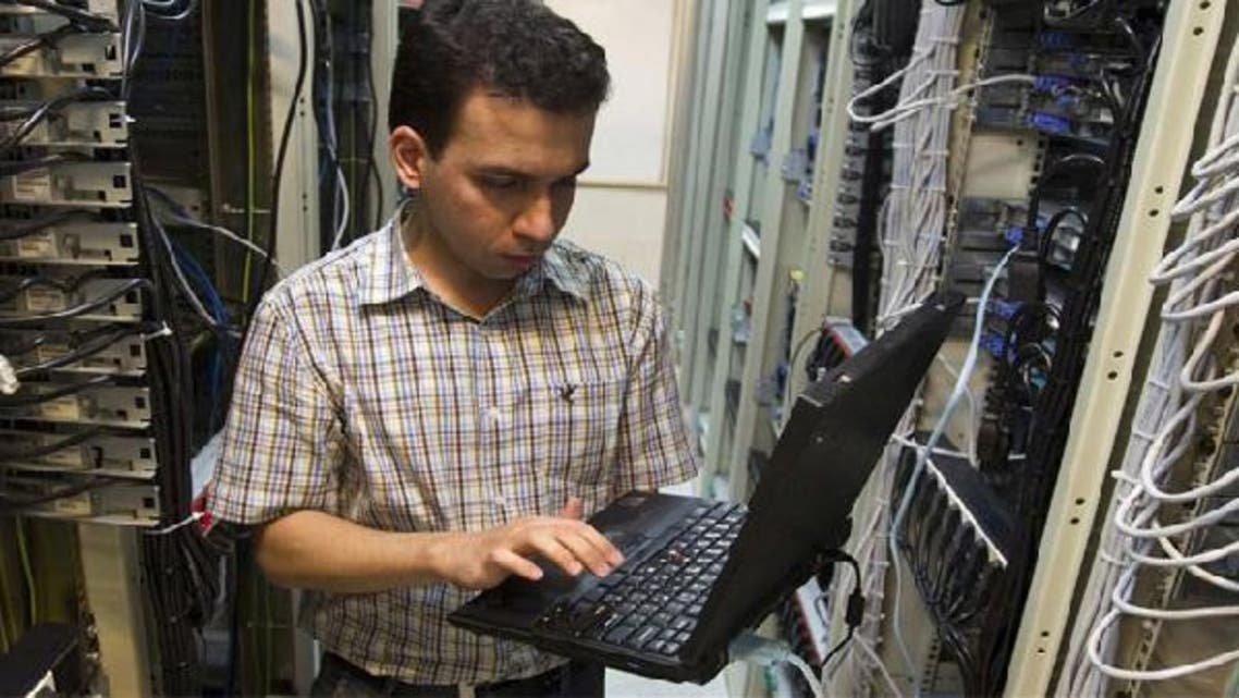 A computer engineer checks equipment at an Internet service provider in Tehran. (Reuters)