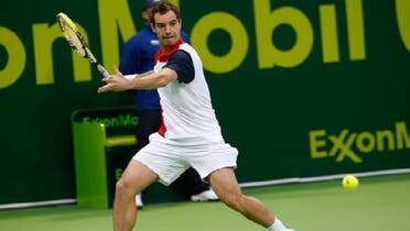 Richard Gasquet of France hits a return to Daniel Brands of Germany during their Qatar Open men’s singles tennis match in Doha January 4, 2013. (Reuters)