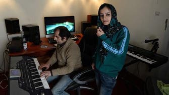First Afghan female rapper seeks reason with rhymes