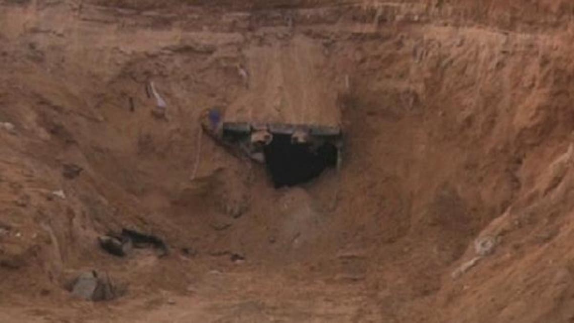 Rafah\'s tunnel workers return to a crater strewn landscape after eight days of bombing by Israel. (Reuters)