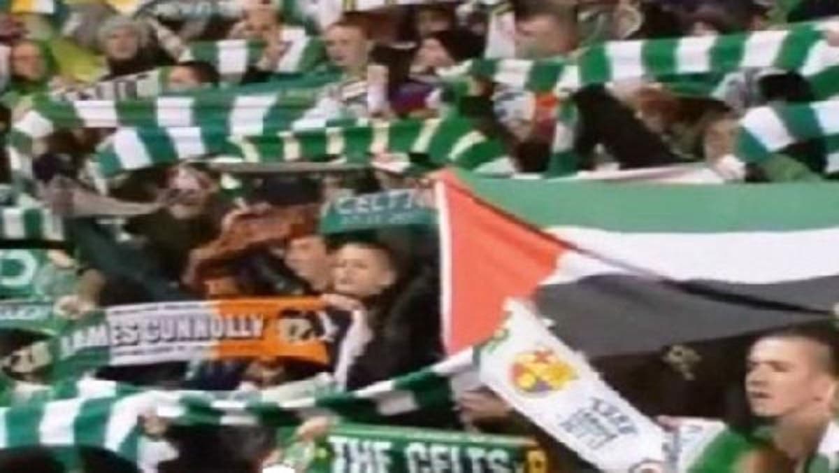 Scottish football fans fly flag of Palestine in match against