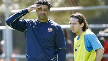 Frank Rijkaard pictured with Lionel Messi during a training session when the Dutchman used to coach the Catalan club. (AFP)