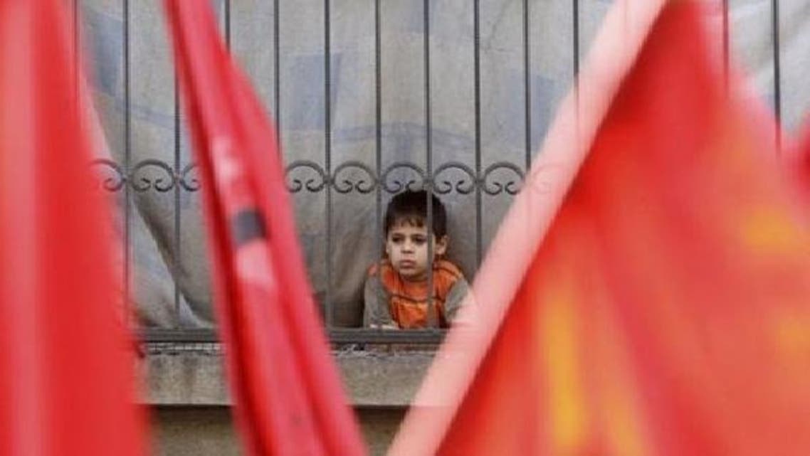فلسطینی مہاجر کیمپ میں مقیم ایک بچہ۔