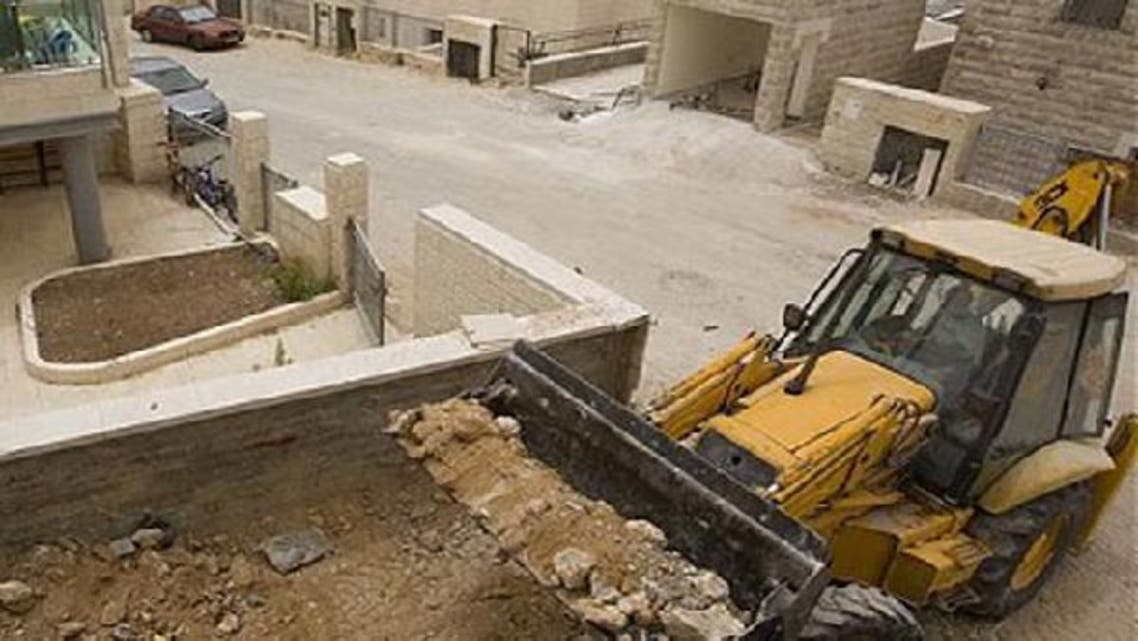 Palestinian laborers working on a construction site in the east Jerusalem Jewish settlement of Ramat Shlomo in 2010. (AFP)