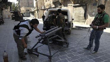 Rebels prepare a homemade mortar-launcher in Aleppo, which is fired using a PlayStation controller. (AFP)