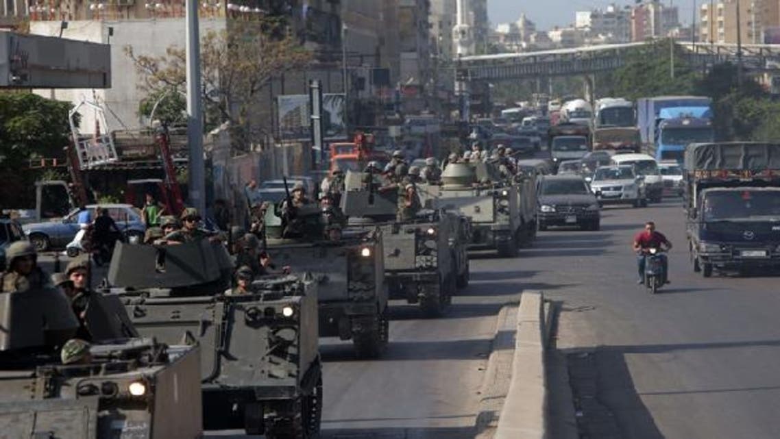 Lebanese army tanks deploy in the Bab al-Tabbaneh and Jabal Mohsen neighborhoods where clashes were taking place in the coastal city of Tripoli, northern Lebanon. (AFP)