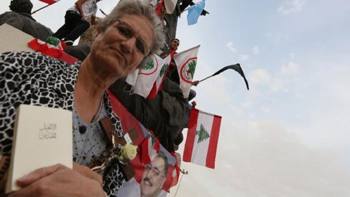 A Christian woman stands during a protest against the killing of senior intelligence official Wissam al-Hassan at Martyrs’ square in downtown Beirut October 20, 2012. (Reuters)