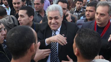 Egyptian potential presidential candidate, Hamdeen Sabahi (R) talking to people during one of his presidential campaign tours in central Cairo. (Reuters)