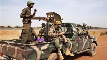 Malian soldiers ride in a Malian army pickup truck in Diabaly January 26, 2013. (Reuters)