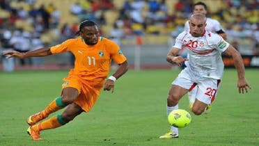 Ivory Coast’s Didier Drogba (L) challenges Tunisia’s Aymen Abdennour during their African Nations Cup Group D soccer match in Rustenburg Jan. 26, 2013. (Reuters)