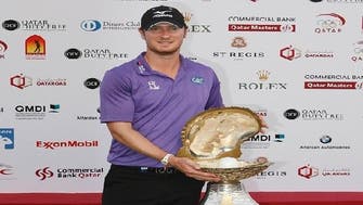 Wood wins Qatar Masters with eagle at 18th