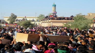 Iraqis gather during the funeral of one of six people killed by Iraqi troops the day before during a protest in the town of Fallujah, west of the Iraqi capital Baghdad on January 26, 2013. (AFP)