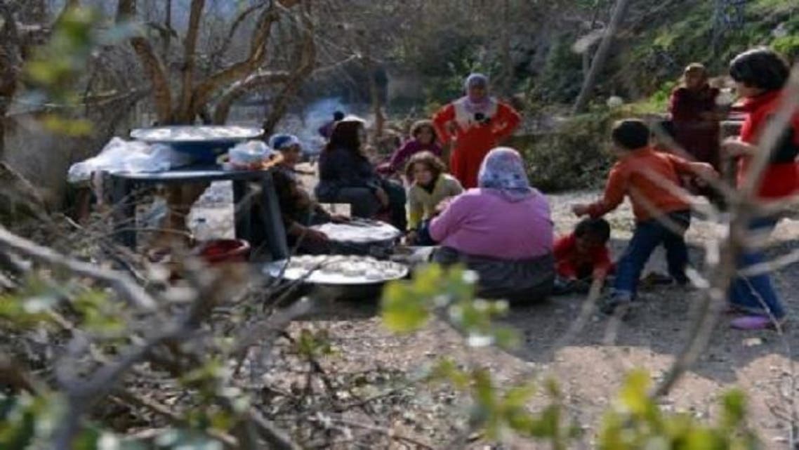 Displaced Syrians who fled their homes amid escalating violence gather in the northern town of Darkush on Jan. 25, 2013. More than 60,000 people have been killed in violence across Syria since an anti-regime revolt morphed into an armed insurgency after the regime of President Bashar al-Assad launched a brutal crackdown on dissent. (AFP)