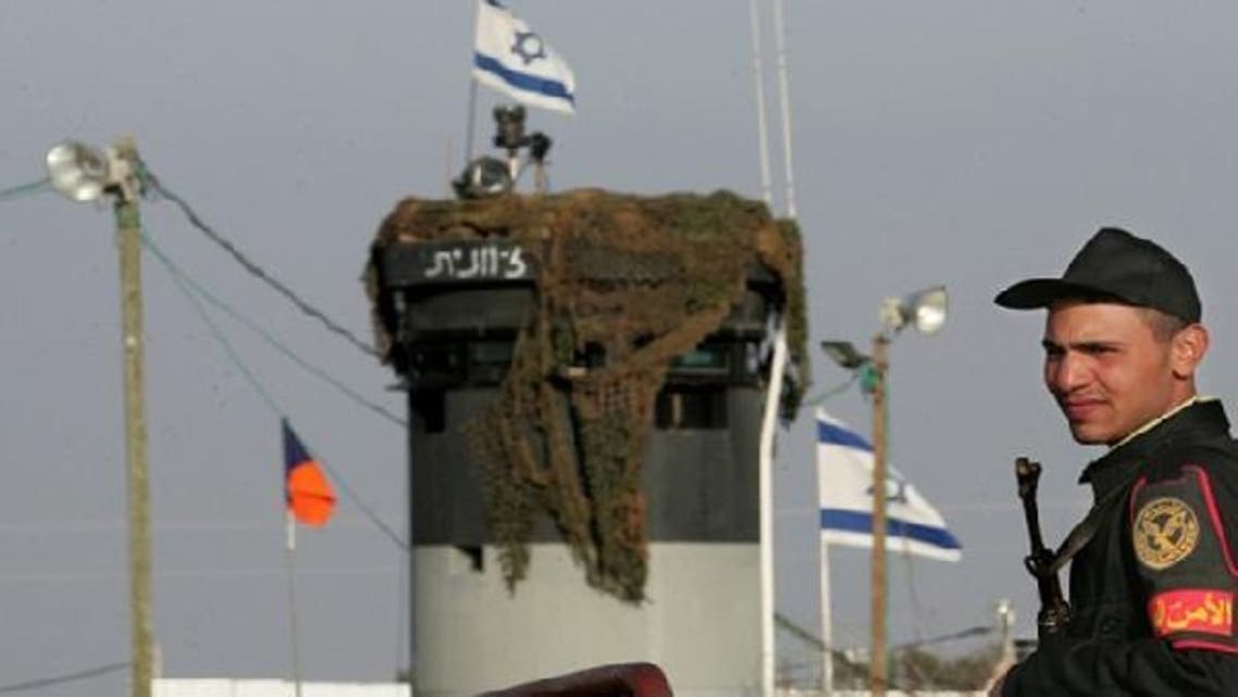 An Egyptian border guard stands near an Israeli border outpost in the Sinai. September 2012, Egyptian media reported that Israel’s spy agency had infiltrated the Sinai. (AFP)