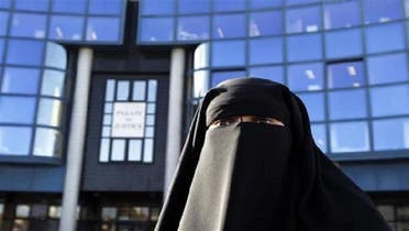 In France, Hind Ahmas wears a niqab despite a nationwide ban on the Islamic face veil outside the courts where she arrived with the intention to pay a fine after she was arrested last May for wearing the niqab in public, in Meaux, east of Paris, Sep. 22, 2011. (Reuters)