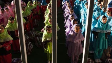 Students line up to go to their classes in Pishtaz School in Tehran in this October 15, 2011 file photo. Like many countries, Iran is concerned that its low population growth rate, estimated at 1 percent by the United Nations in 2011.  (Reuters)