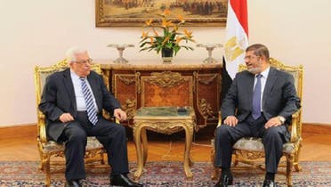 Egypt’s President Mohammed Mursi (2nd R) meets with Palestinian President Mahmoud Abbas (2nd L) to discuss Palestine crisis at the Presidential Palace in Cairo November 13, 2012. (Reuters)