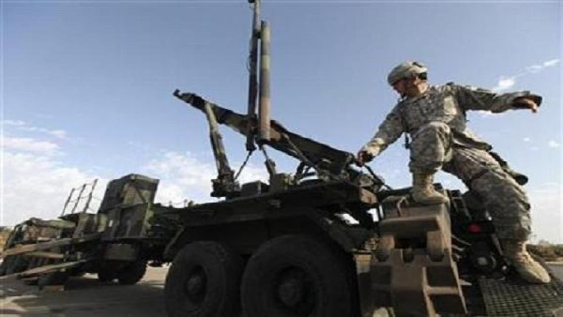 A U.S. Army officer stands on a launcher for a Patriot missile interceptor during a joint Israeli-U.S. air-defense exercise in Tel Aviv October 2009. (Reuters)