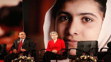 Pakistan\'s President Zardari (L) and UNESCO Director-General Irina Bokova attend the event \\"Stand up for Malala, Girls\' education is a right!\\" during the United Nations Human Rights Day at the UNESCO headquarters in Paris Dec. 10, 2012. (Reuters)