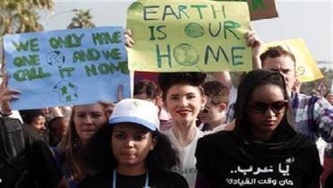 Activists march to demand action to address climate change in Doha on Dec. 1, 2012.(Reuters)
