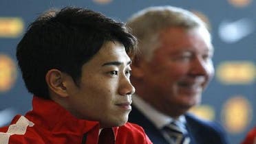 The 23-year-old Manchester United midfielder is pictured with coach Alex Ferguson. (AFP)