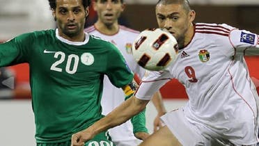 Jordan’s forward Odai Al-Saifi (R) challenges Saudi Arabia’s forward Yasir Al-Qahtani during their 2011 Asian Cup group B football match in Qatar. (AFP)