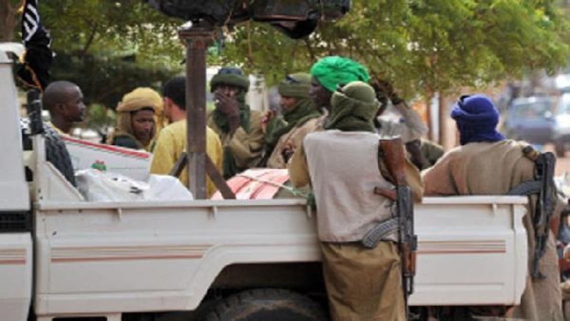 A file photo taken on September 21, 2012 shows a group of armed Islamists gathered in Gao, the biggest city in northern Mali now under the control of armed Islamist groups. (AFP)