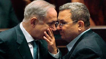 Israeli Prime Minister Benjamin Netanyahu (L) speaks with his Defence Minister Ehud Barak during a Knesset session. (Reuters)