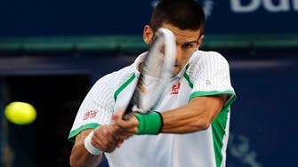 Tennis-Djokovic overcomes stubborn Del Potro in Dubai