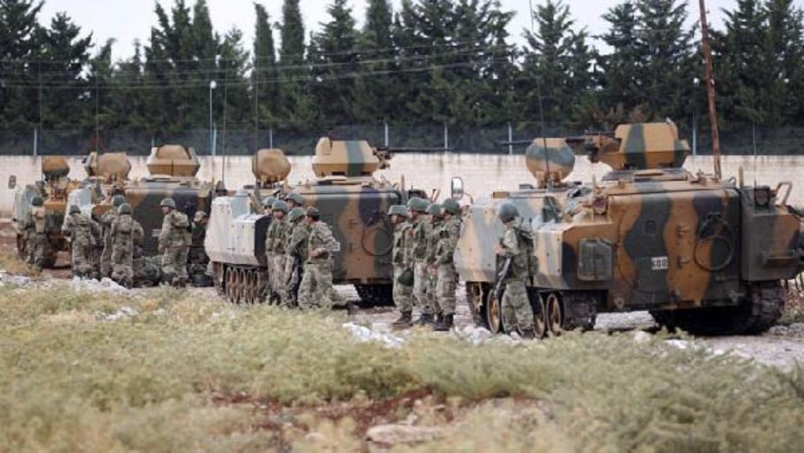 Turkey sent a convoy of about 20 vehicles carrying troops, missile batteries and armoured vehicles to the border with Syria. (Reuters)