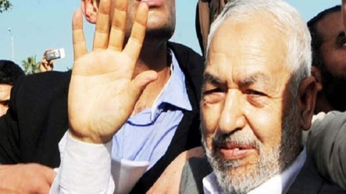 A file photo taken on January 30, 2011 shows Rached Ghannouchi, the leader of Tunisia’s Islamist movement Ennahdha waving upon his arrival at the Tunis-Carthage airport after 22 years in exile in Tunis. (AFP)