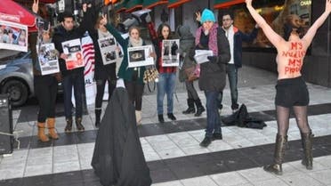 Members of the Iranian Communist Party and the Organization Against Violence on Women in Iran dedicated their action to International Women’s Day on March 8. (Photo courtesy of femen.org)