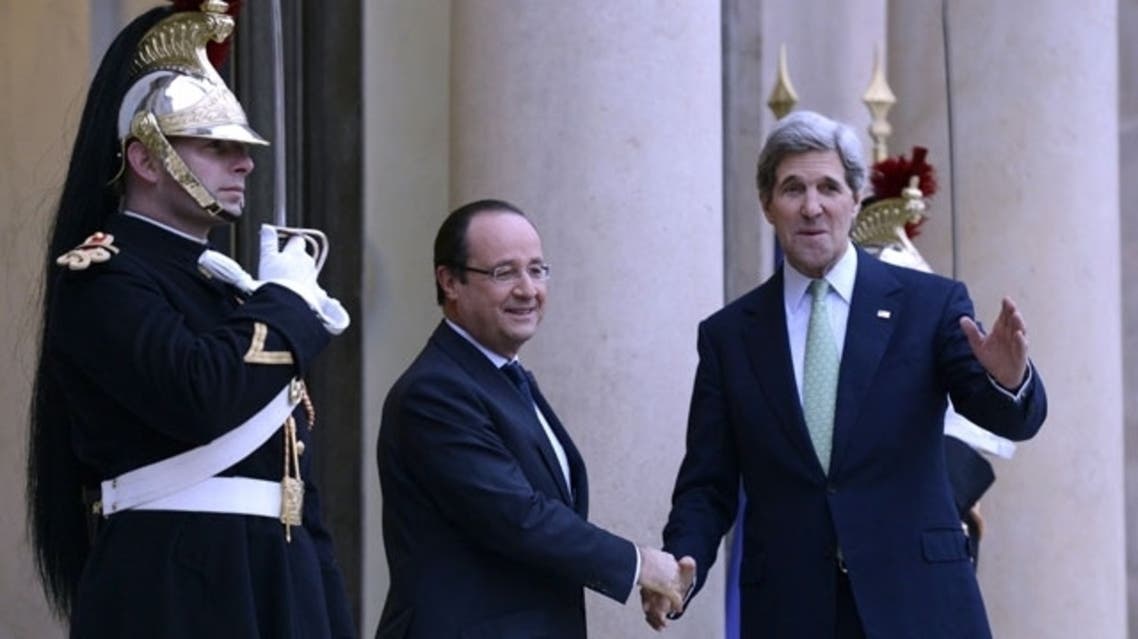 French President Francois Hollande (L) welcomes US Secretary of State John Kerry prior to a meeting at the Elysee presidential Palace, on Feb. 27, 2013, in Paris. (AFP)
