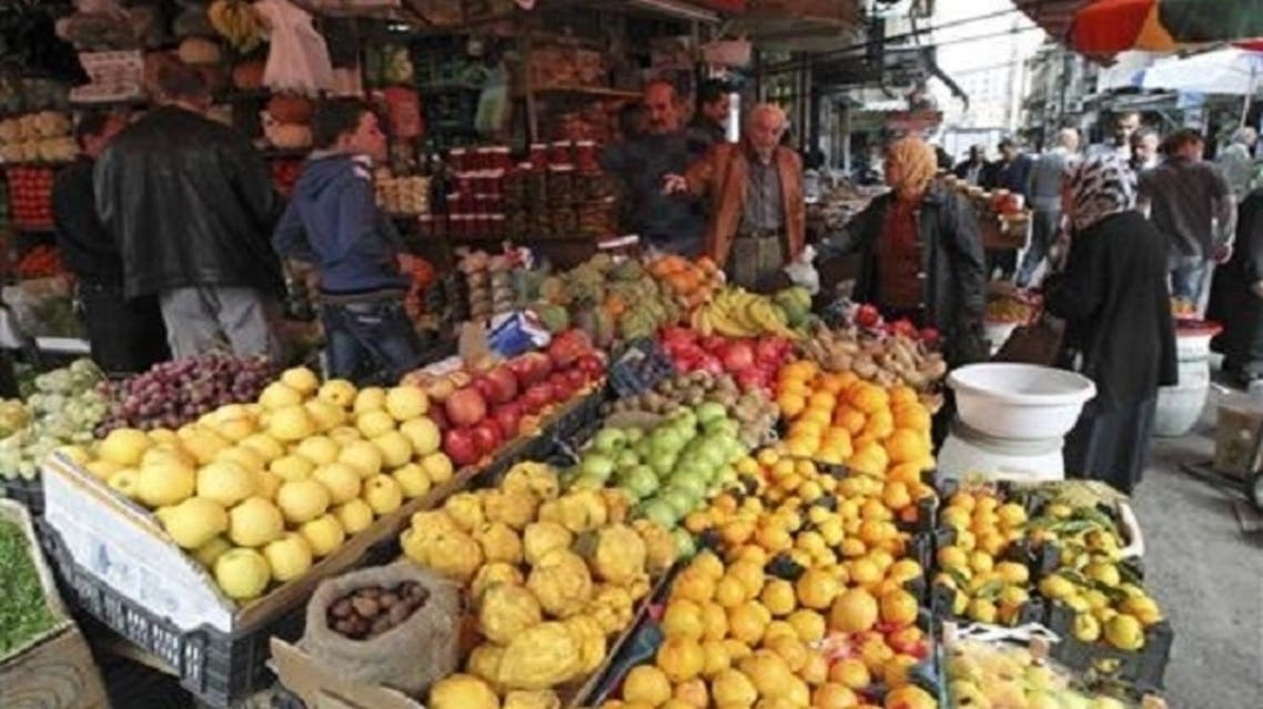 Customers buy fruits along a street in Damascus. However, there are many who feel trapped between an unloved authority in the form of the 43-year-old Assad dynasty and hungry revolutionaries at the gates, who resent the city’s privileged lifestyle (Reuters)